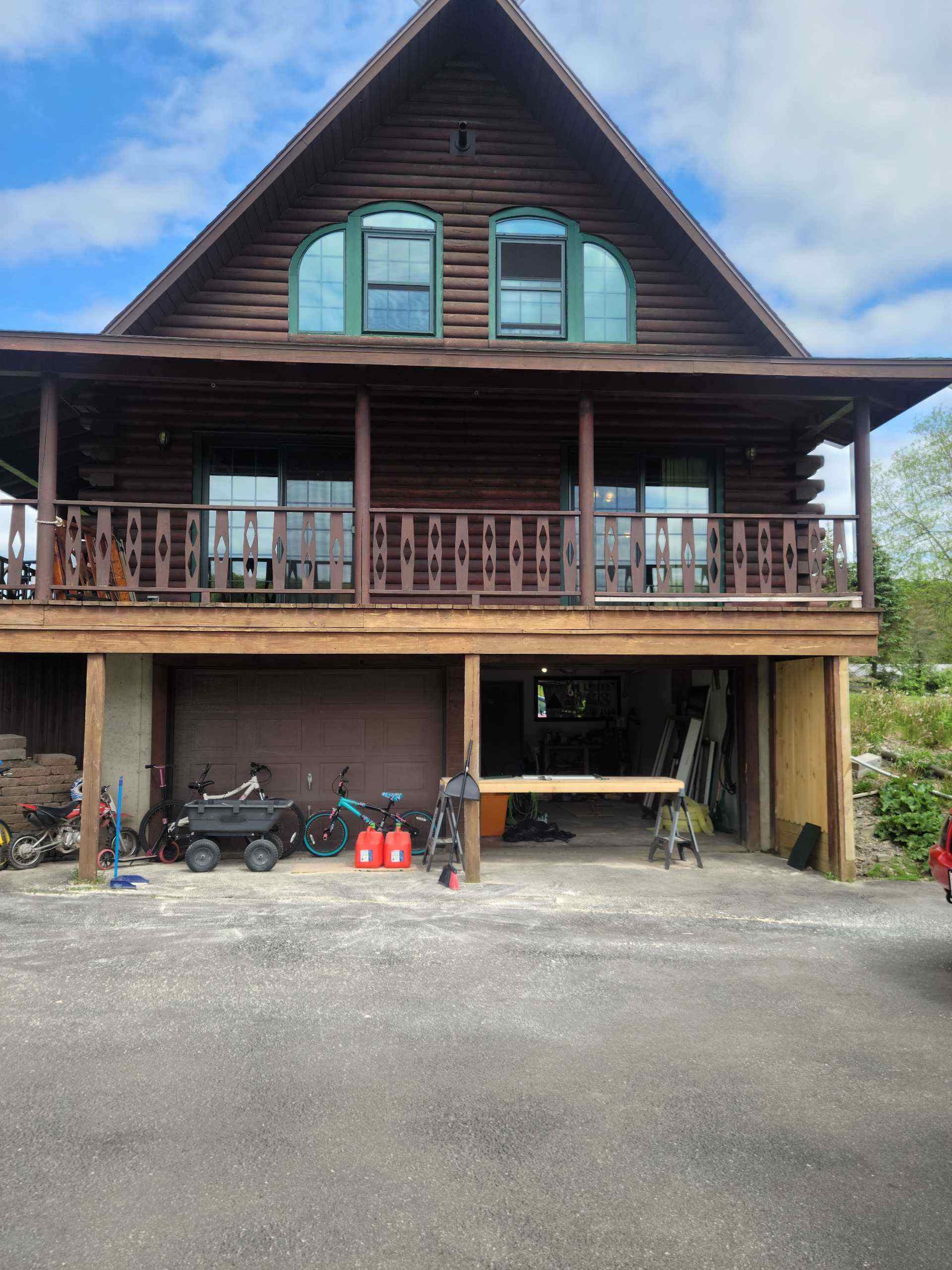Log cabin, large balcony, outdoor workspace.
